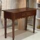 Table console en bois festonnée vintage pieds tournés