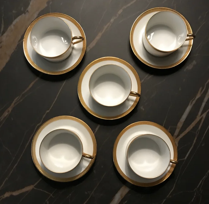 5 Haviland tea cups and sub-cups