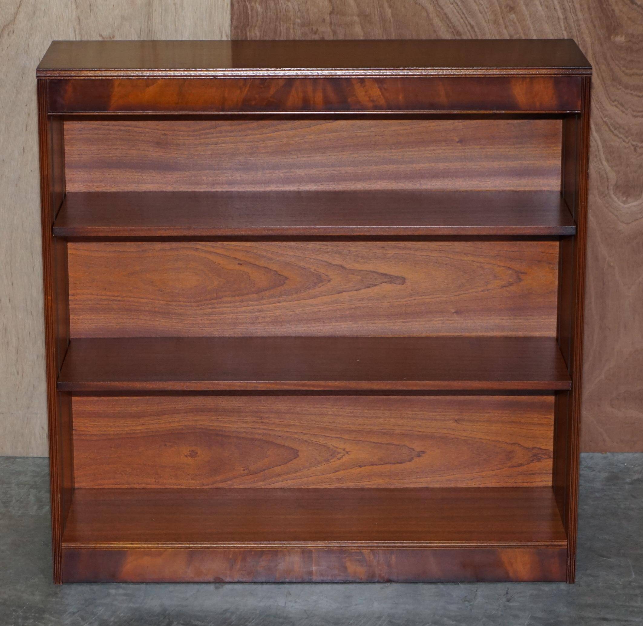 Pair of open dwarf bookshelves in mahogany by Shaws of London.