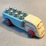 Small wooden milk truck with its cans, antique toy