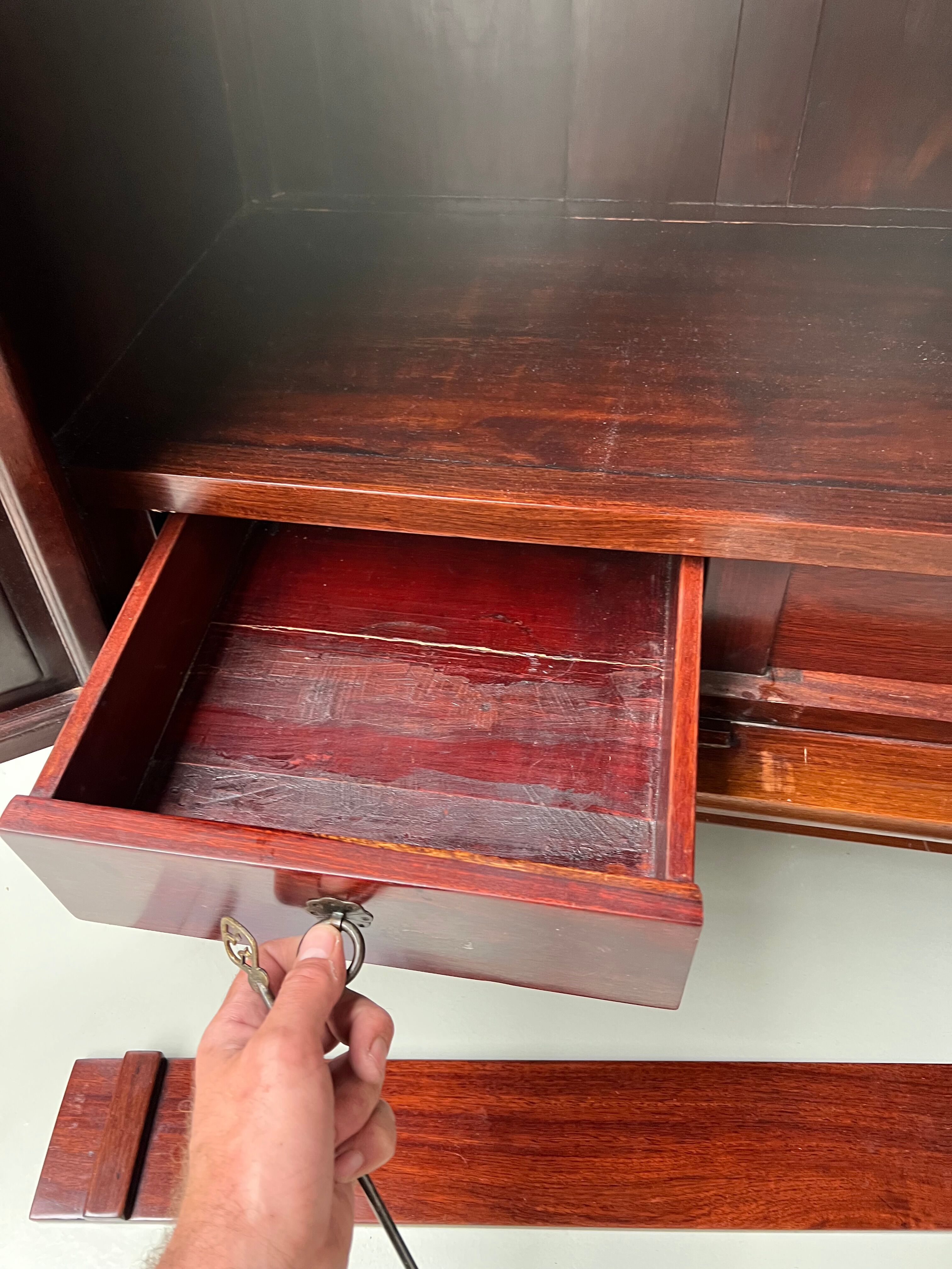 Chinese trapezoidal roller cabinet, made of rosewood.