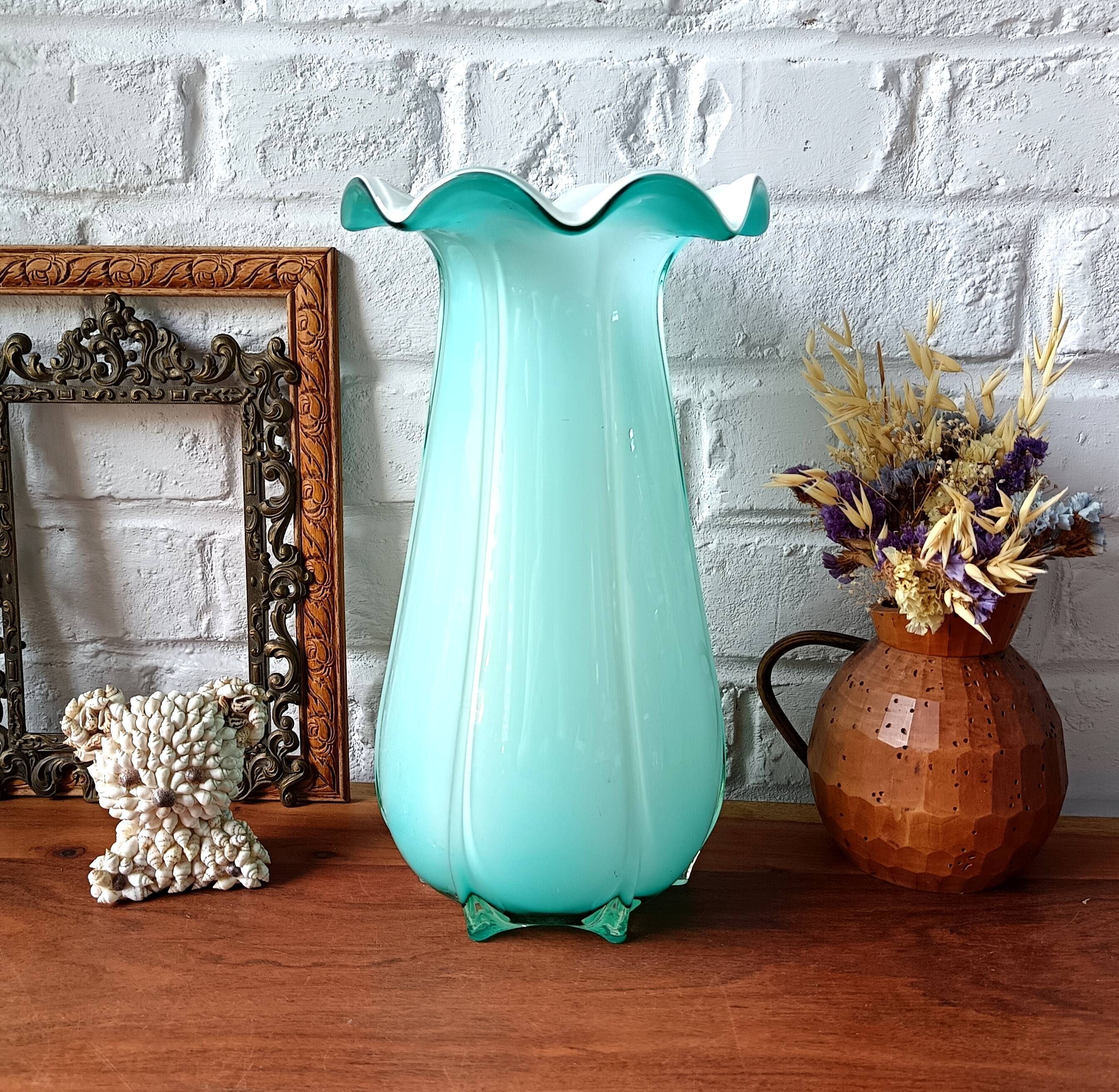 Large light blue opaline vase with a wavy neck.