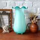 Large light blue opaline vase with a wavy neck.