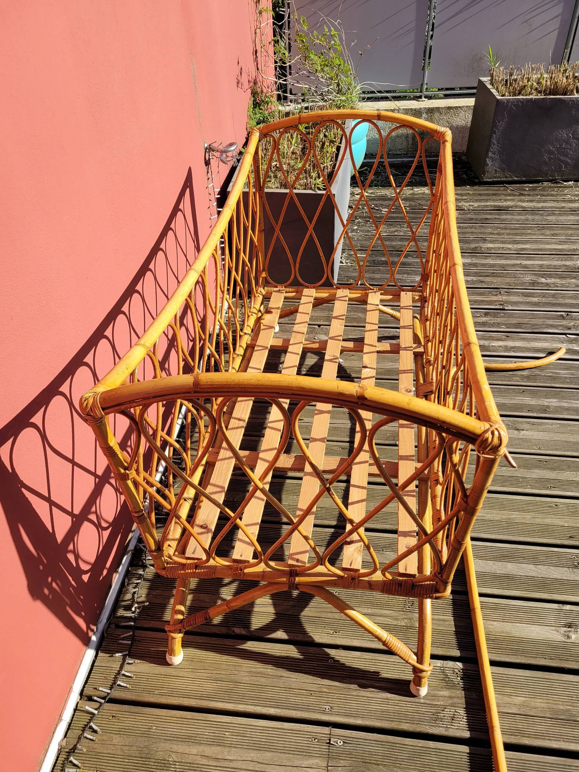 Bamboo and rattan baby cot with canopy.