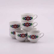 7 white porcelain cups from Winterling with coloured patterns.