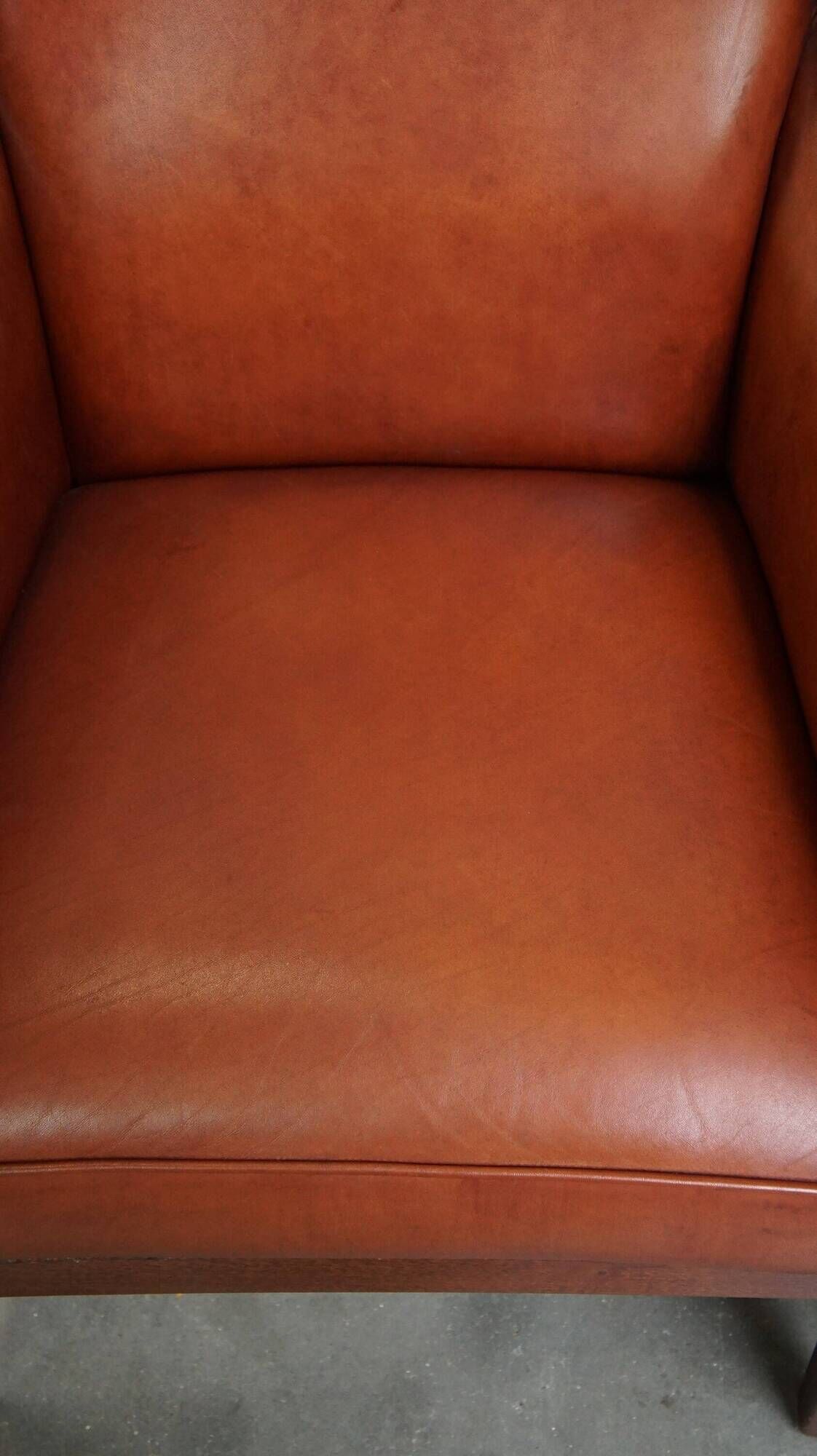 Majestic, luxurious set of 2 cognac-colored cowhide leather Art Deco design armchairs