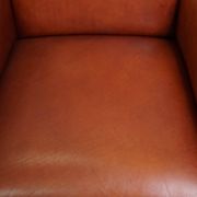 Majestic, luxurious set of 2 cognac-colored cowhide leather Art Deco design armchairs