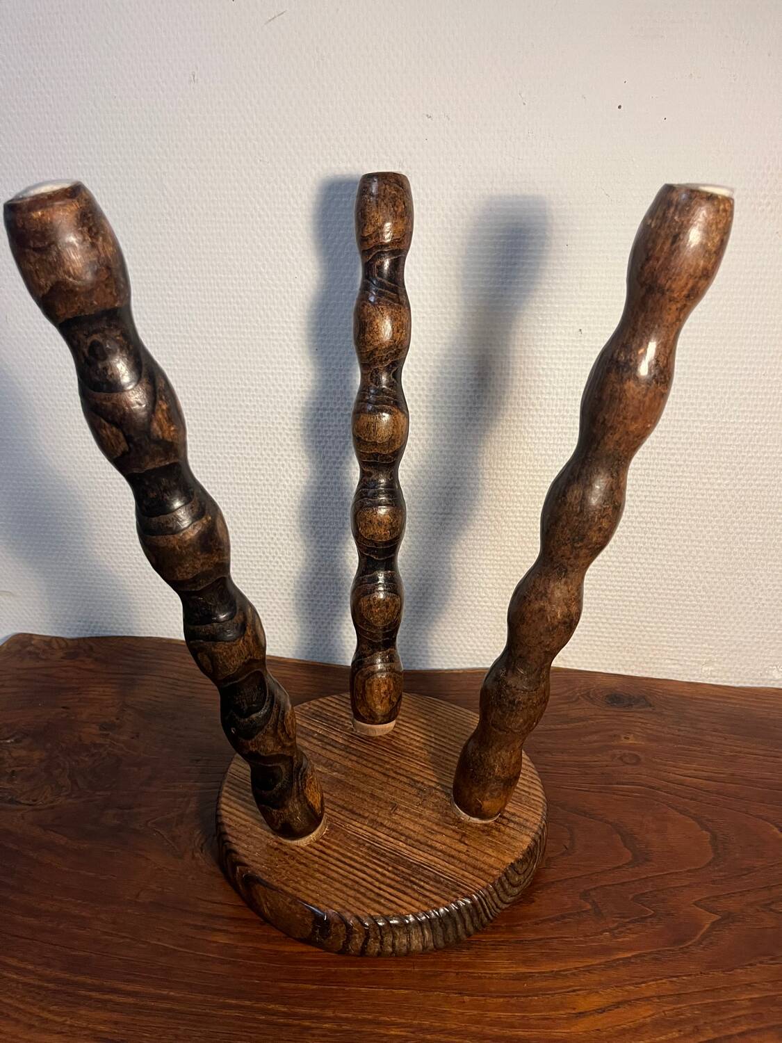 Round wooden tripod stool