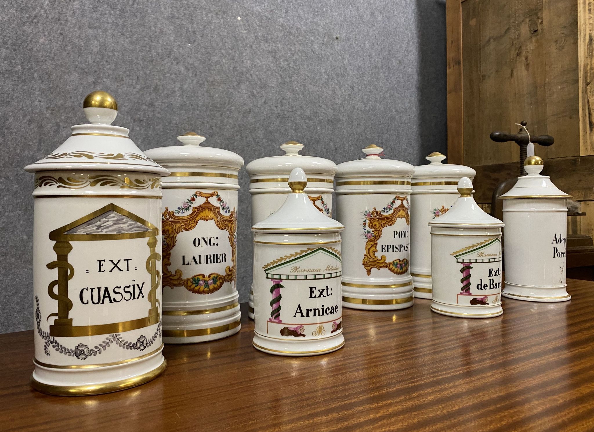 Set of 8 Paris porcelain pharmacy jars with white background with gilding