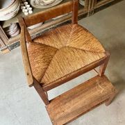 High chair made of wood and straw.