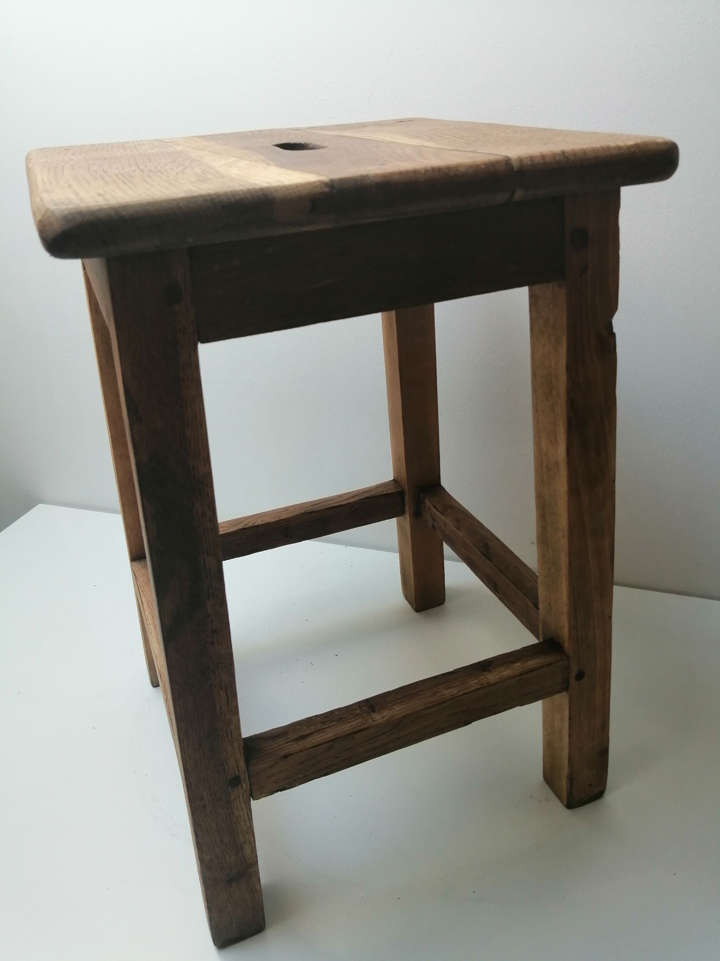 Old farm or workshop stool in oak