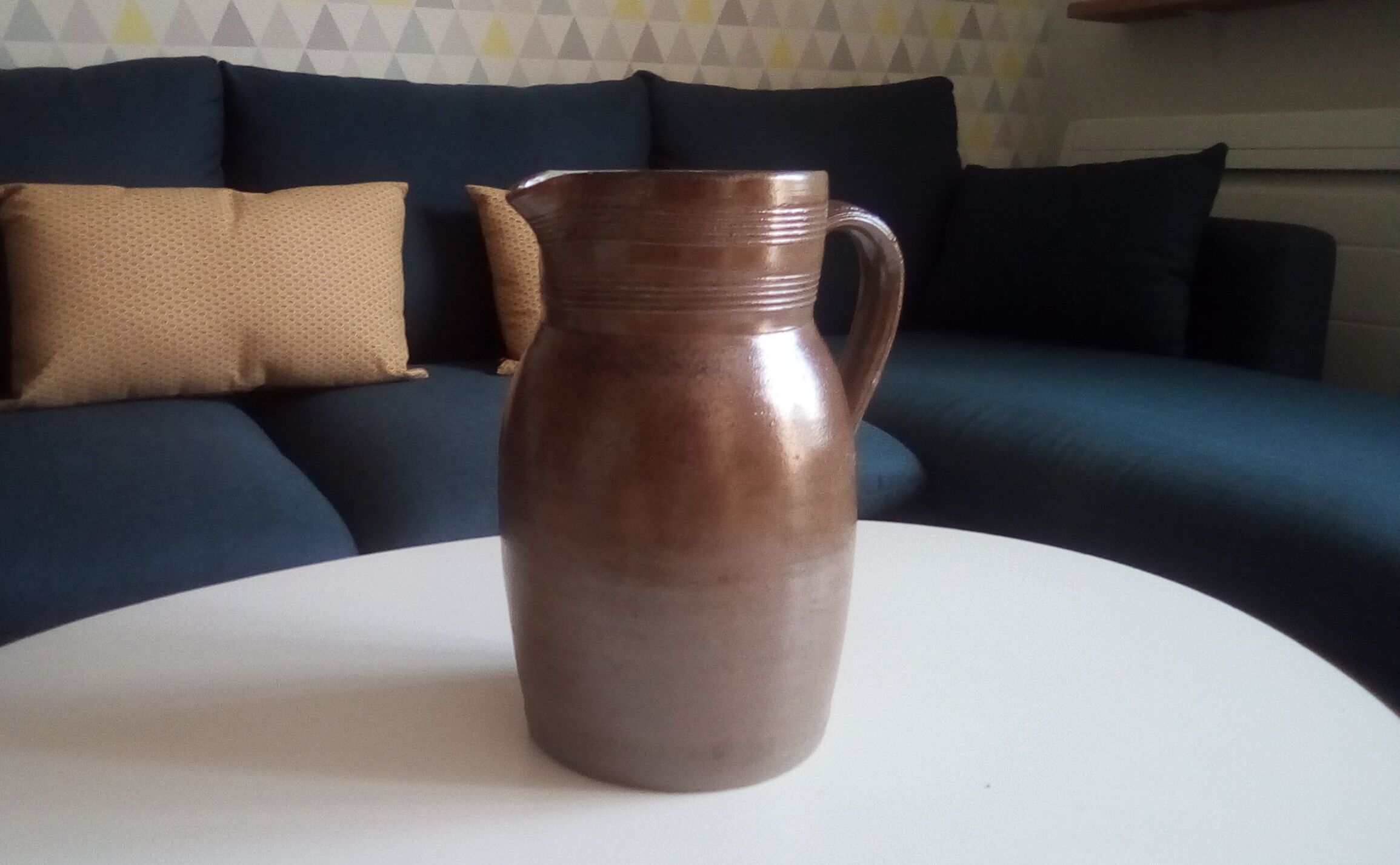 Vintage pitcher in glazed sandstone