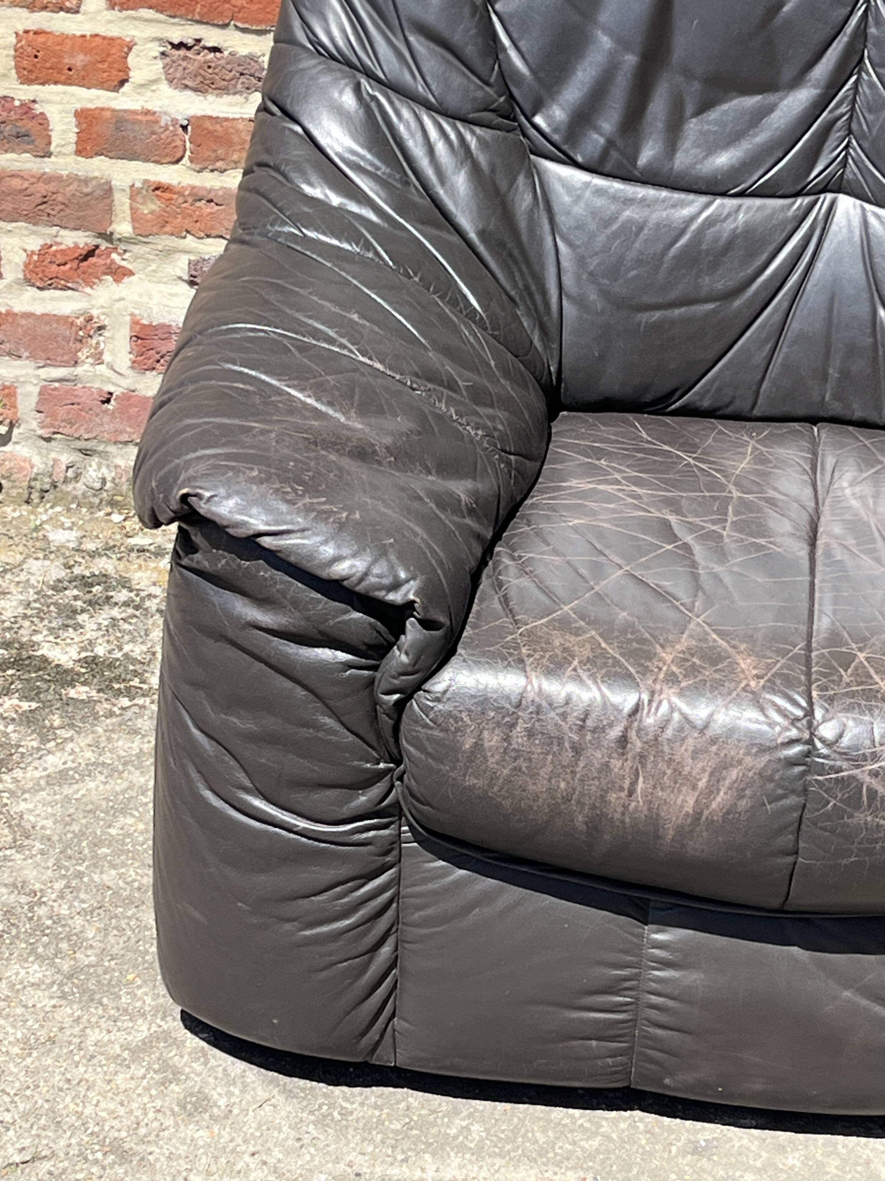 Pair of patinated leather club armchairs