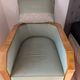 Vintage armchair Hugues Chevalier Paris — Almond green leather & Wood