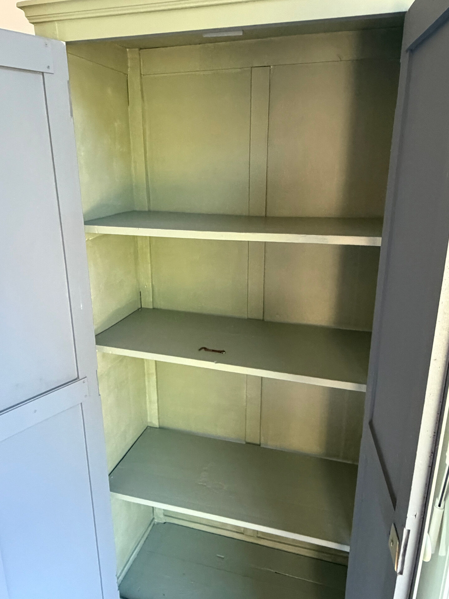 Antique Parisian wardrobe in sage green patina