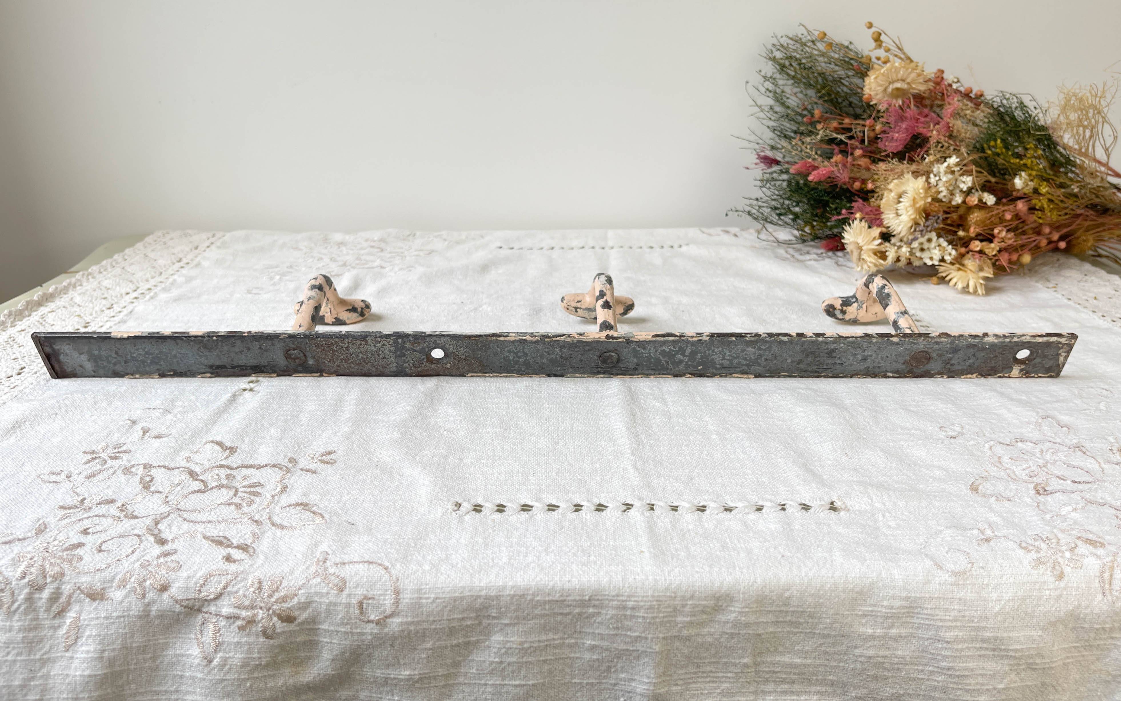 Vintage enameled cast iron wall hook with 3 hooks