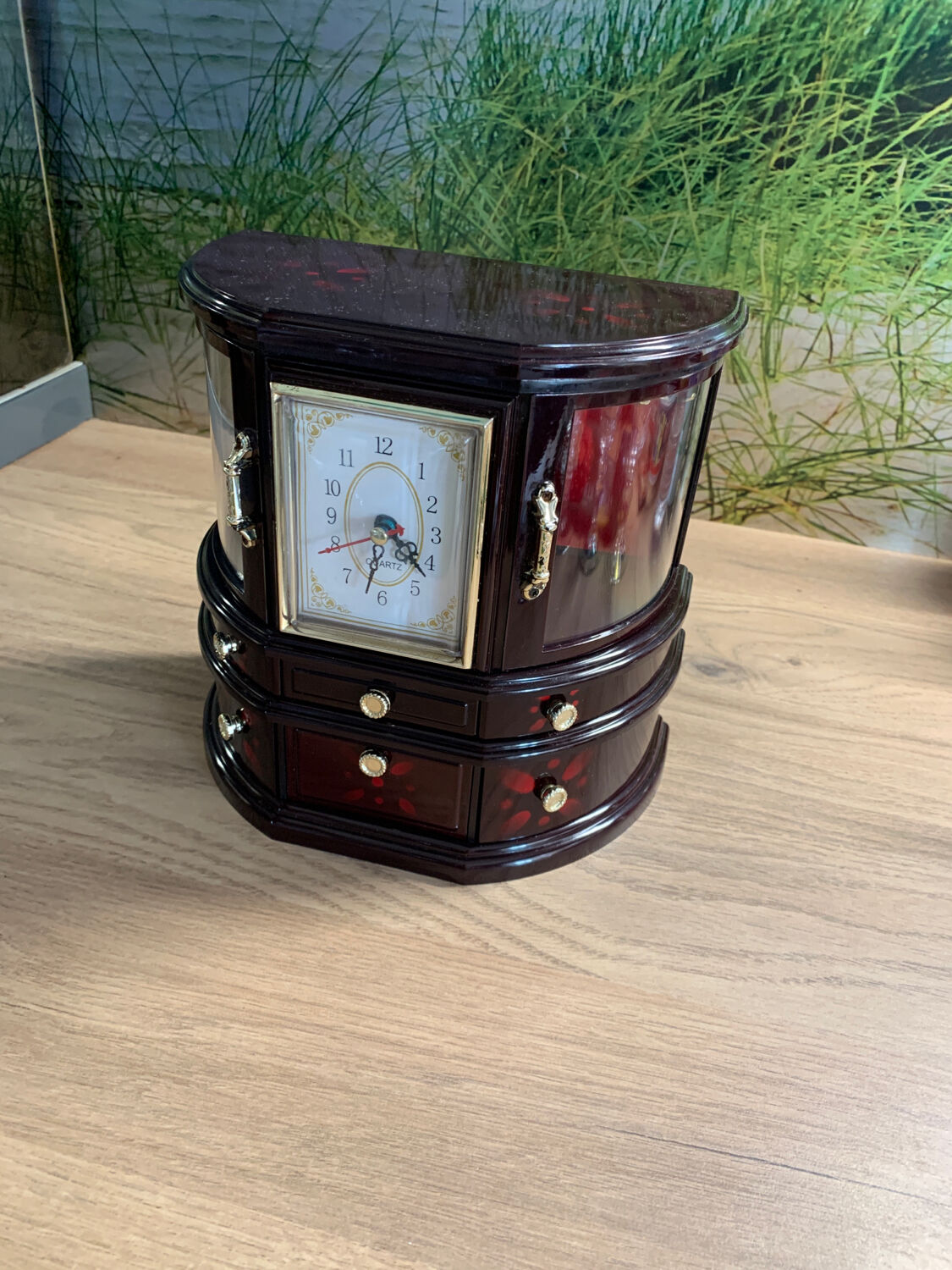 Jewelry cabinet with clock