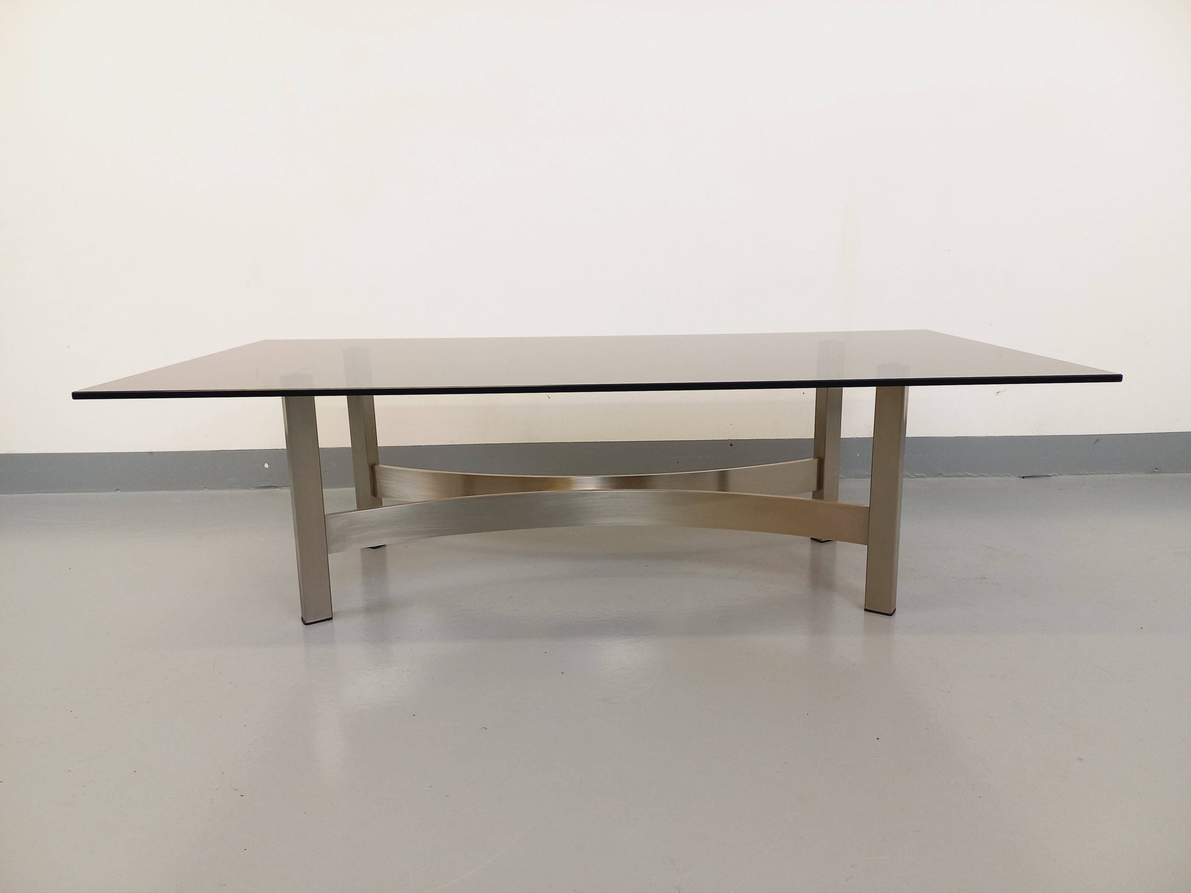 Vintage coffee table in smoked glass and brushed cast aluminum from the 70s