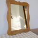 Wooden mirror with a shaped frame