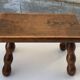 Footstool in varnished wood turns old