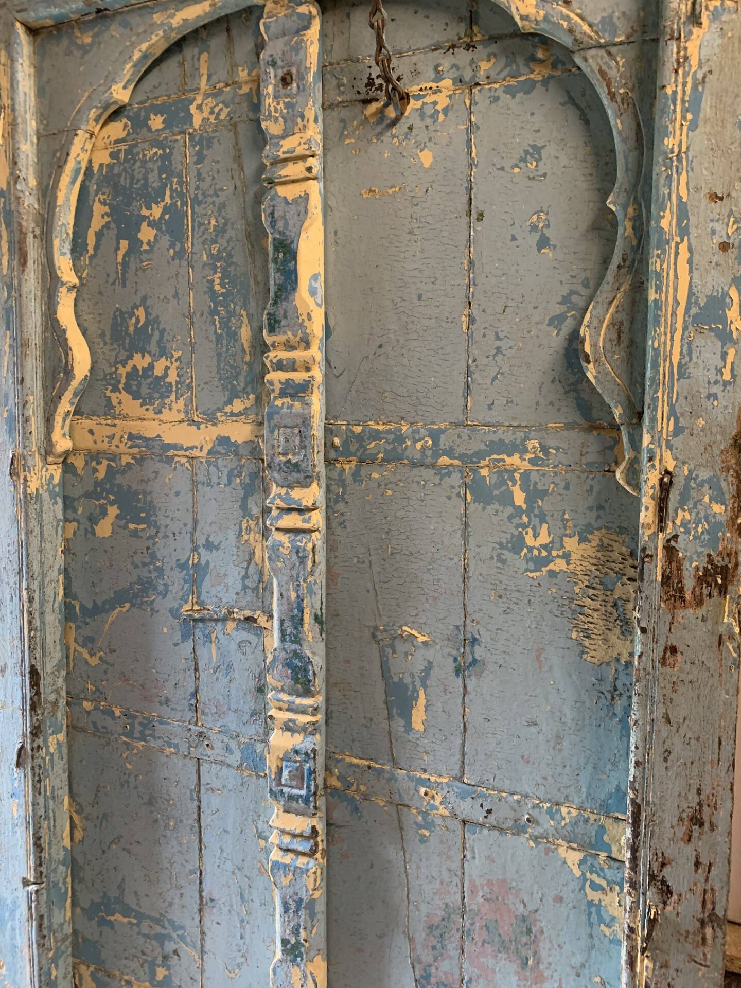 Blue patinated indian door with carved frame