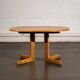 Oval dining table with 2 extensions.