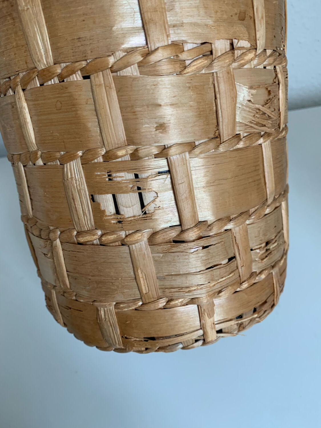 Green glass jar with wickerwork