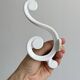 Set of 4 white lacquered metal hooks,