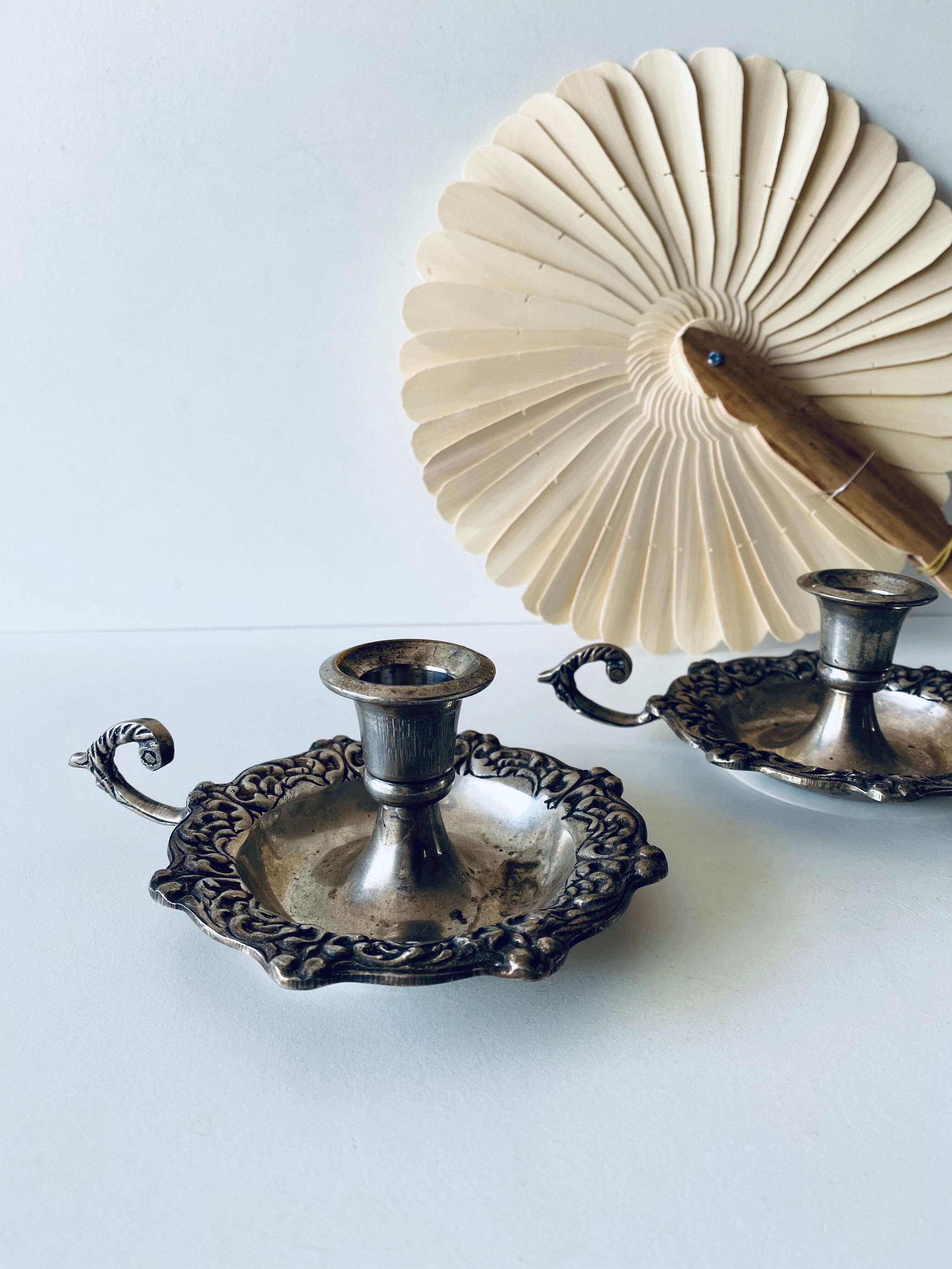 Pair of silver metal candlesticks