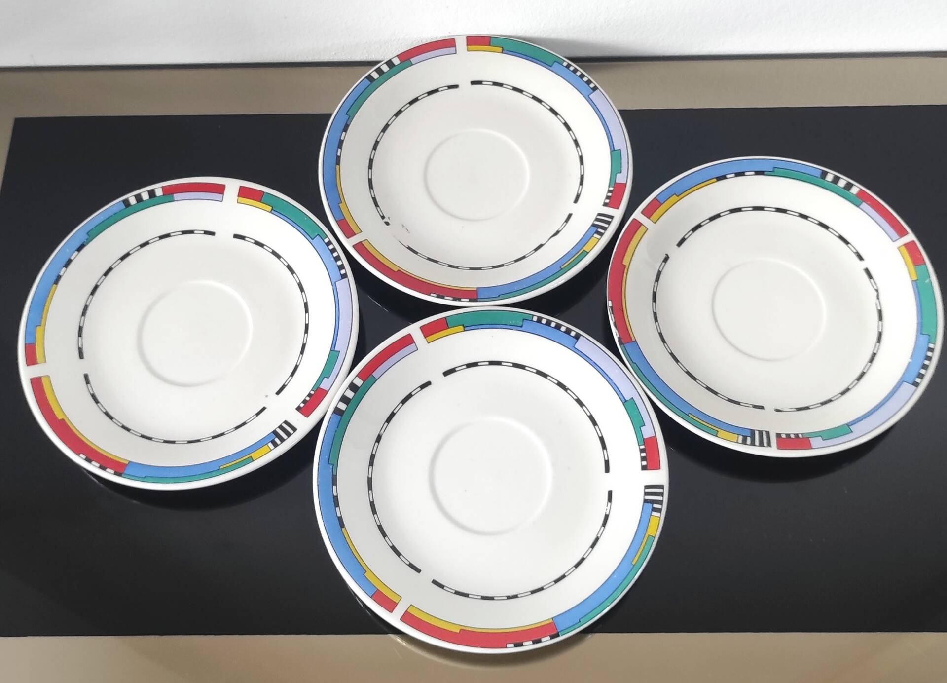 Set of small plates, vintage saucers in porcelain.