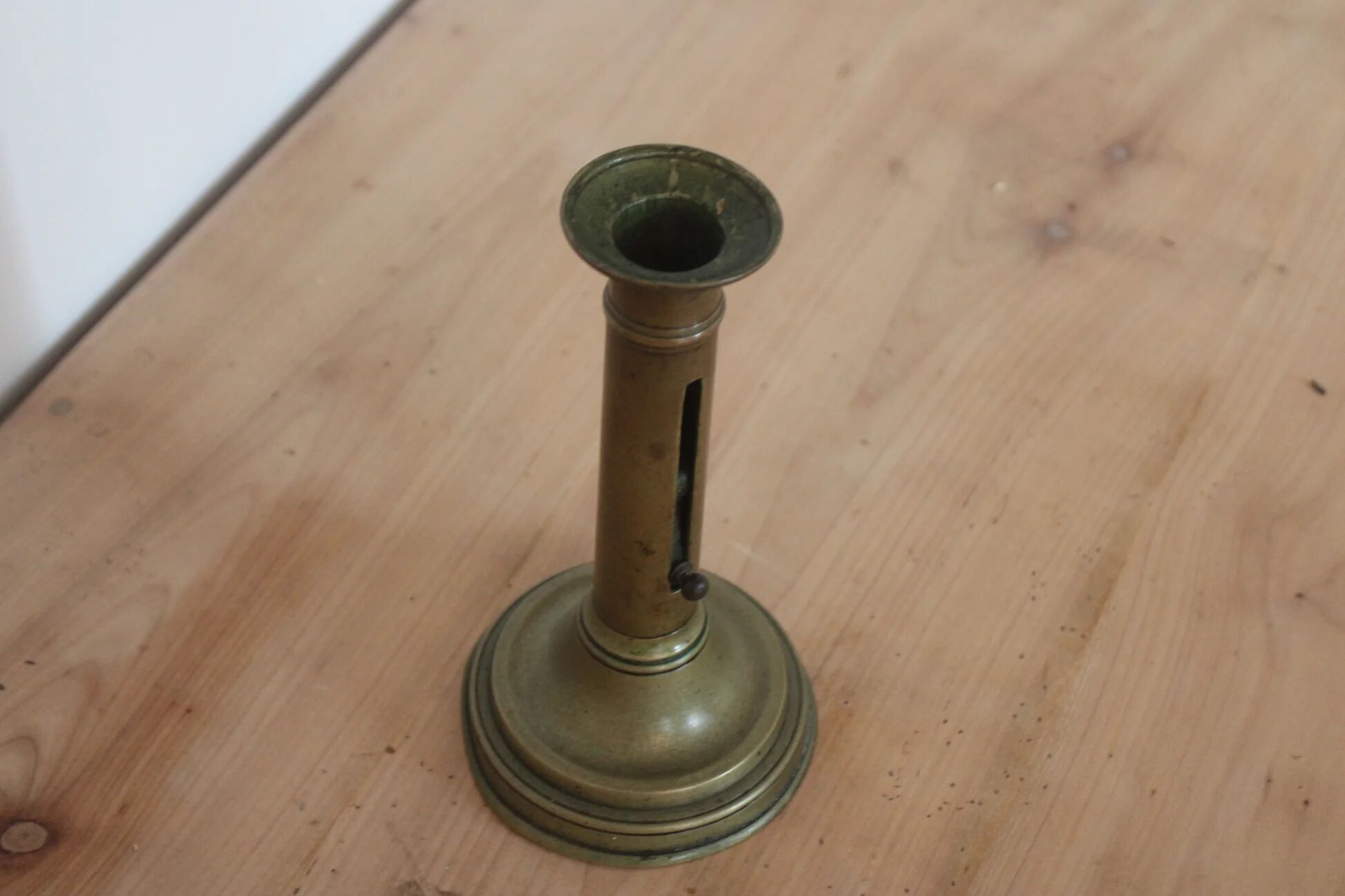 Antique brass push candle holder – vintage patinated candlestick H20 cm