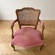 Pair of antique Louis XV armchairs in wood, caning and pink velvet.