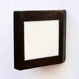 Double-sided patinated triangular wall light
