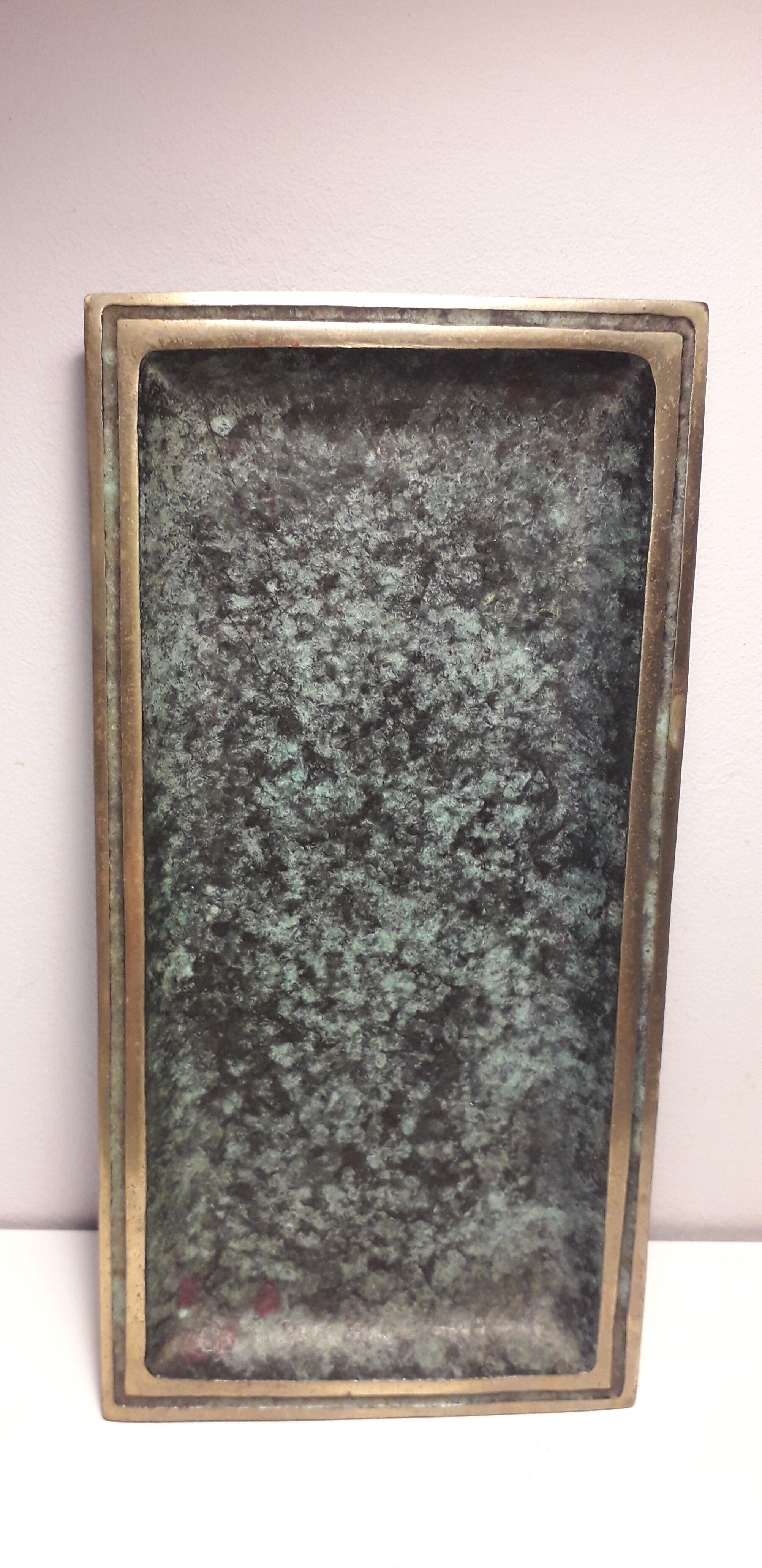 Empty top rectangular pocket in green patinated bronze