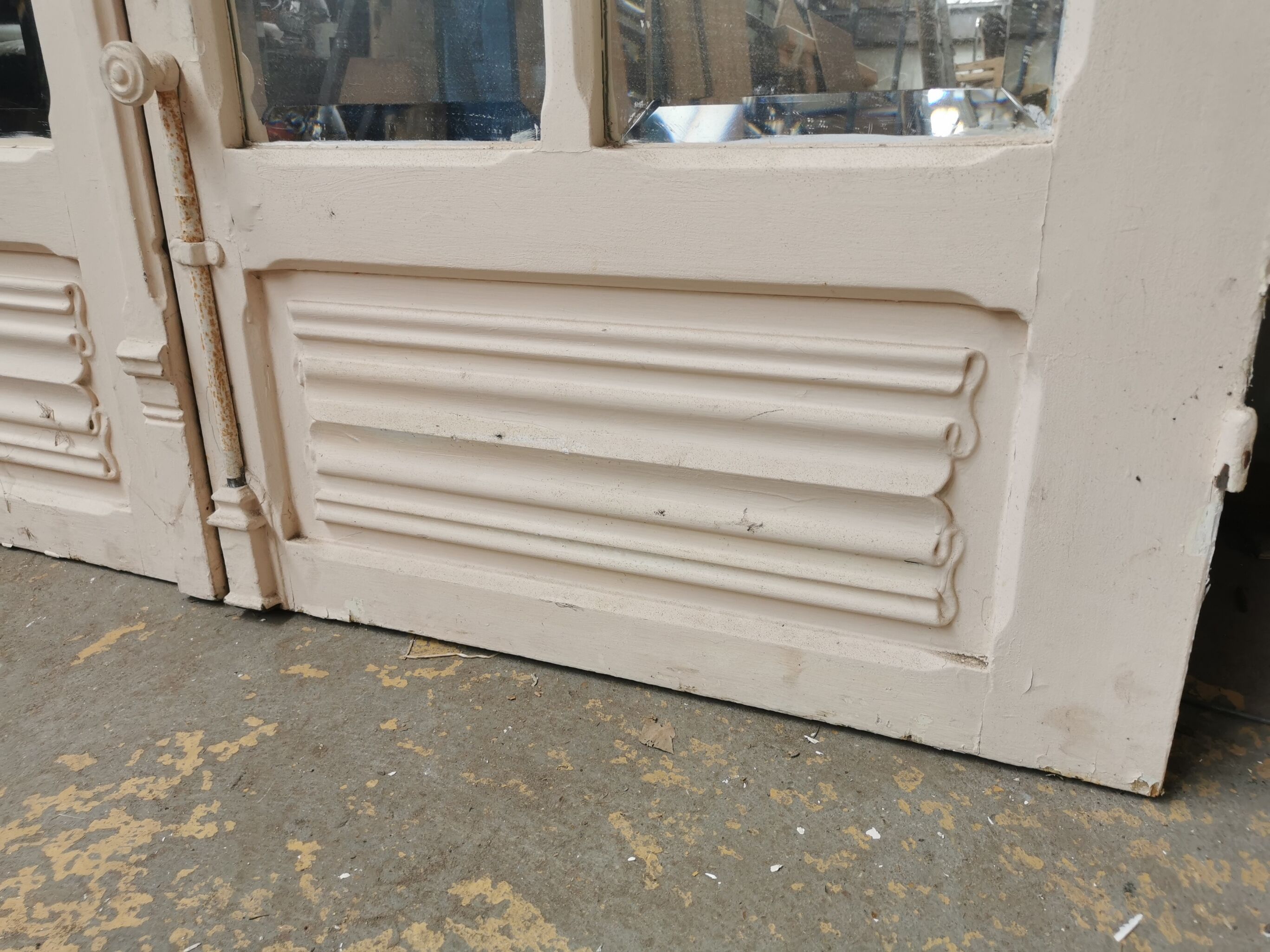 Pair of old haussmannian doors with bevelled mirrors