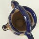Old pitcher (goat) in cobalt glazed earthenware