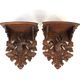 Pair of carved wooden wall consoles decorated with a deer's head
