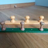 Wall-mounted coat rack with 3 mushroom-shaped hooks