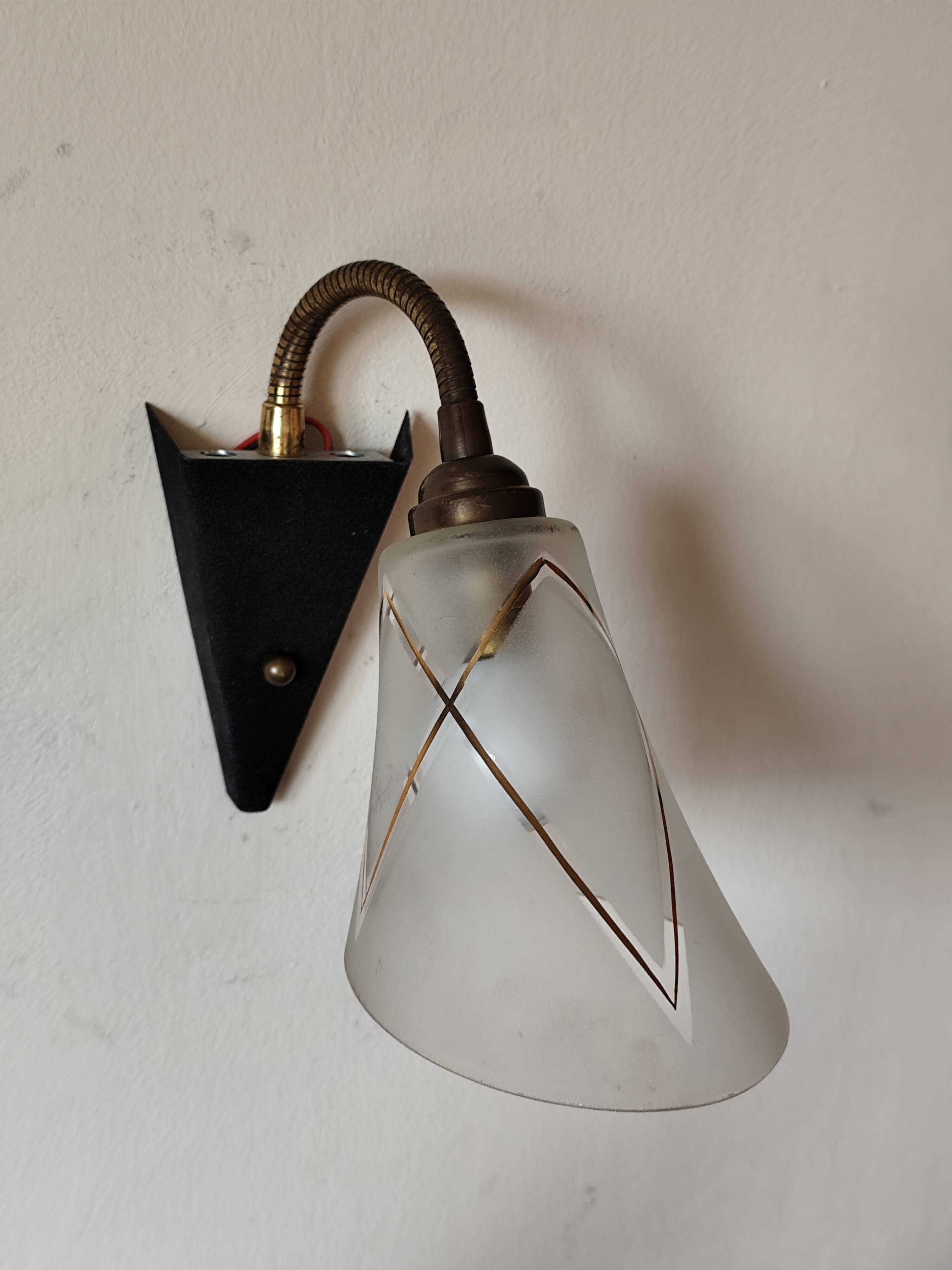 1950s wall lamp, metal, flexible brass stem and opaque shade.