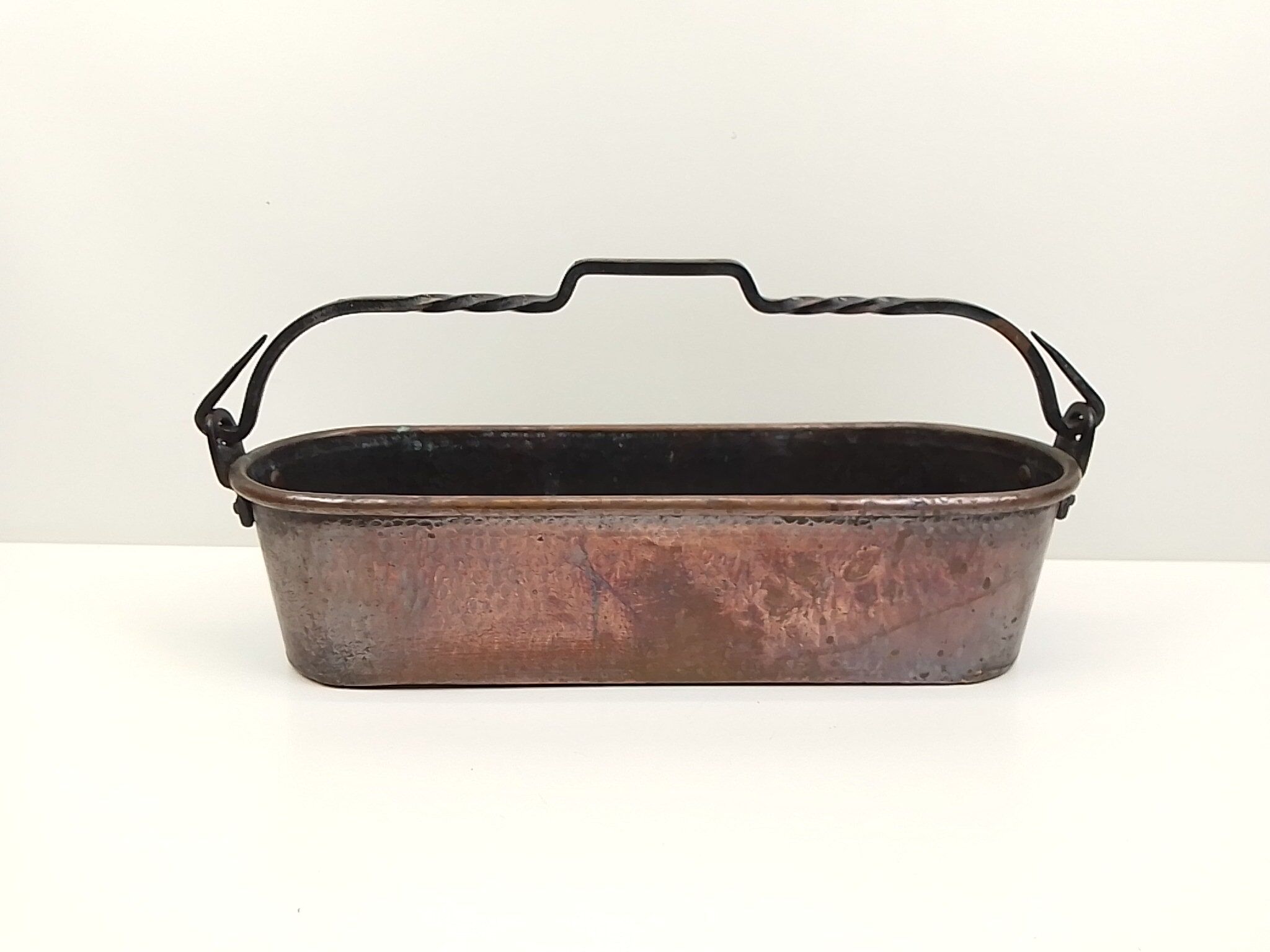 Copper planter and wrought iron handle