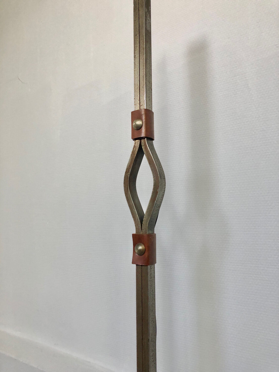 Hammered wrought iron and leather floor lamp by Jean Pierre Rickaert, 1950s