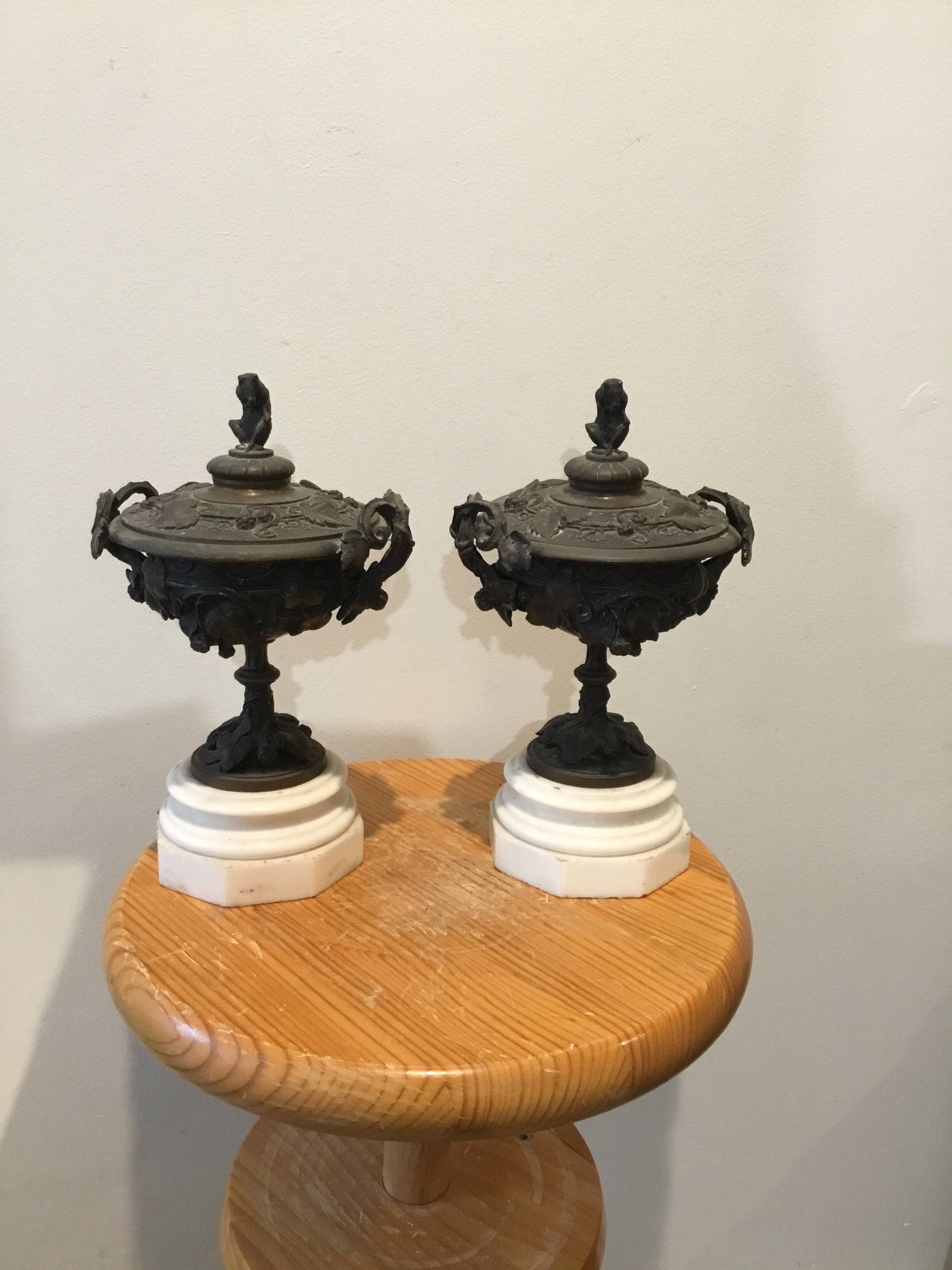 Bronze fireplace garnitures with marble base depicting leaves.