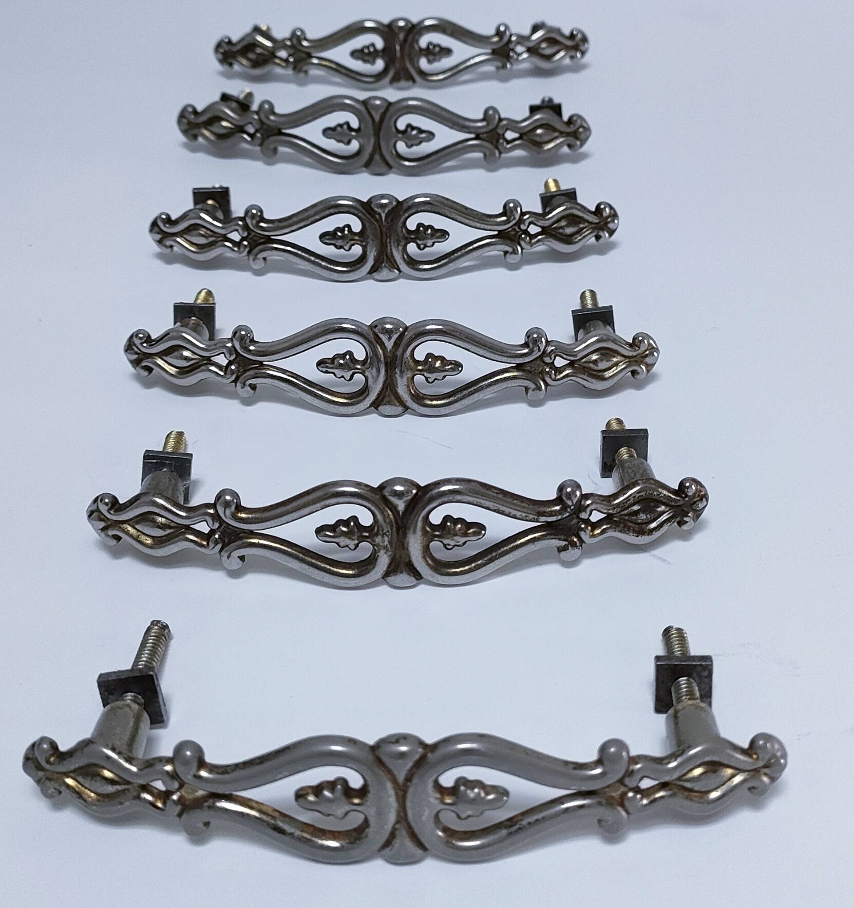 Six Huwil metal handles for neo-classical drawers from the 60s