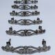 Six Huwil metal handles for neo-classical drawers from the 60s