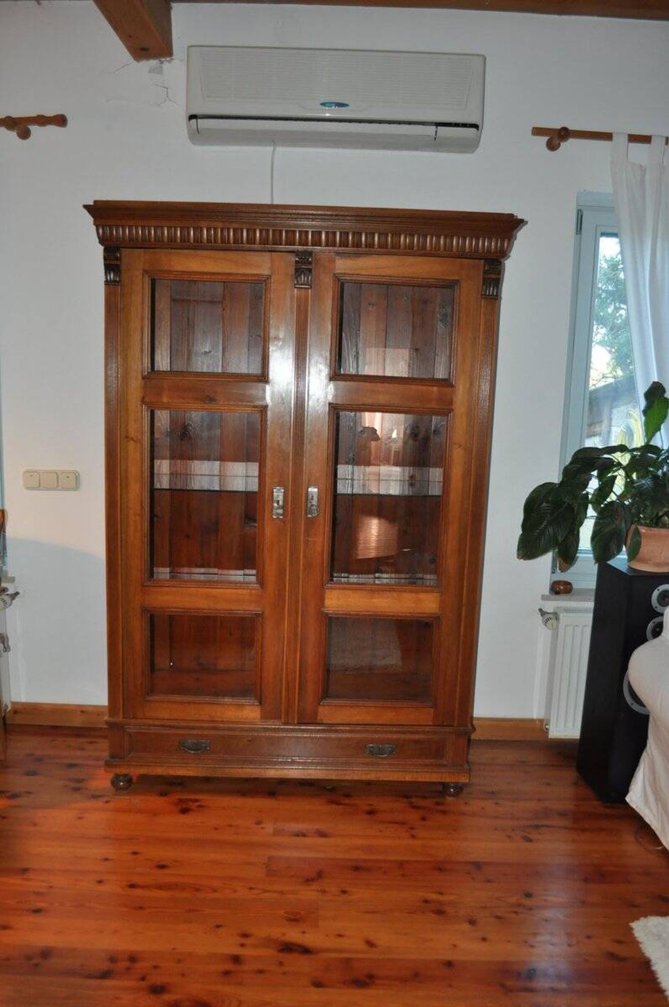 Antique wooden and glass cabinet in brown - 1900 style display case with carved mouldings.