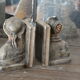 Book-clamps couple of realistic old men in plaster