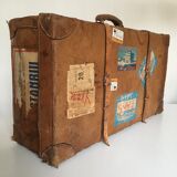 suitcase of leather with labels of palaces