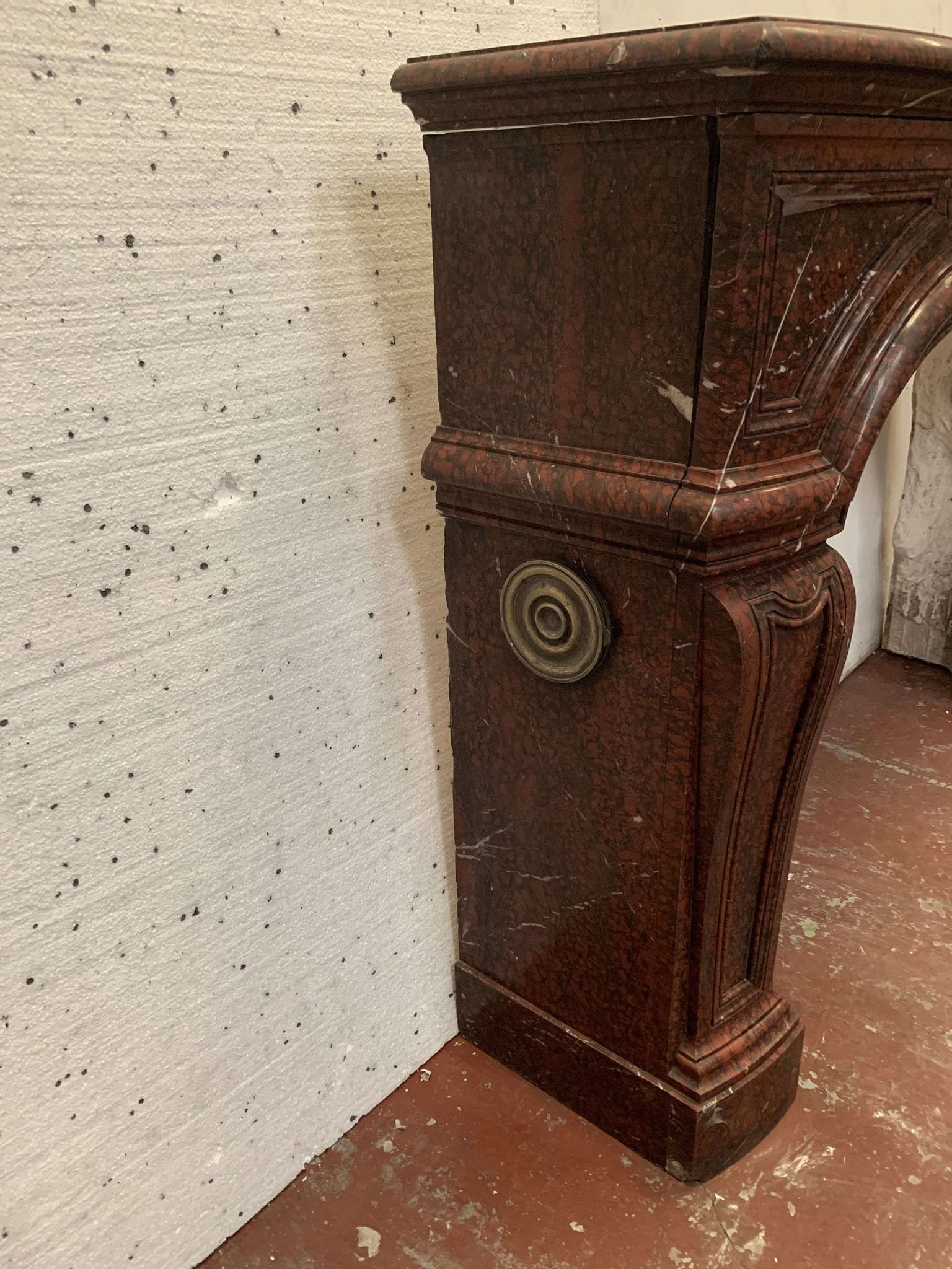 Pair of Louis XIV style fireplaces in red cherry marble. XIX century.