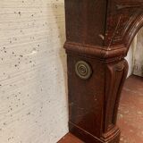 Pair of Louis XIV style fireplaces in red cherry marble. XIX century.