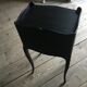 Bedside or nightstand painted black with patterns